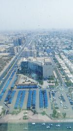 High angle view of buildings in city against sky