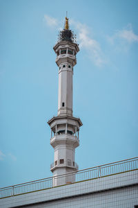 The beautiful asmaul husna tower in the city of kediri with a blue sky background