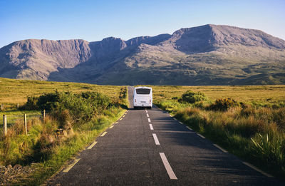 Scenic view of field against mountain