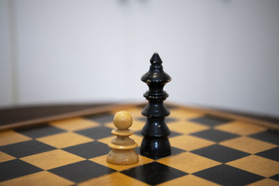 Close-up of chess pieces on floor