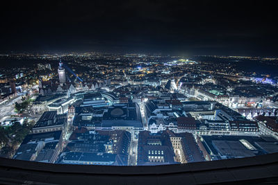 High angle view of illuminated buildings in city at night