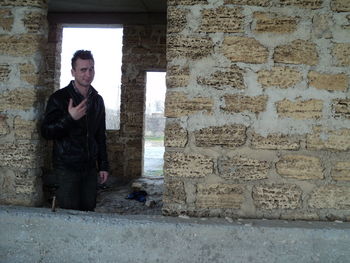 Mid adult man standing in abandoned house