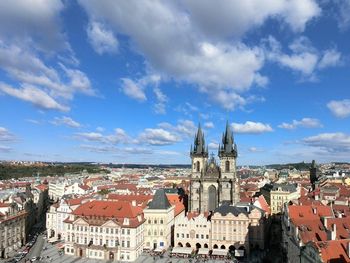 Cityscape against cloudy sky