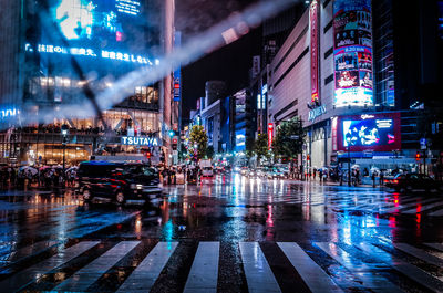 Illuminated city street at night