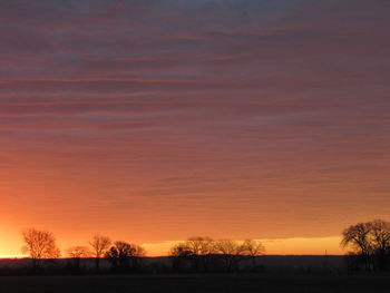 Scenic view of silhouette trees against sky during sunset