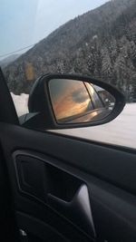 Reflection of car on side-view mirror