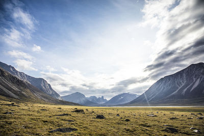 Scenic view of landscape and mountains against sky