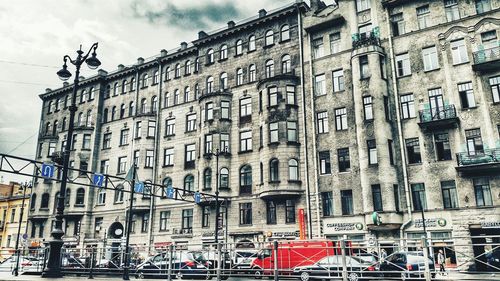 Low angle view of buildings in city against sky