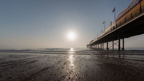 Scenic view of sea against clear sky during sunset