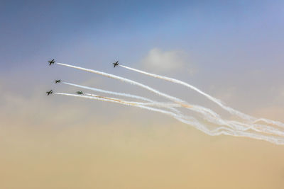 Low angle view of airplane flying in sky