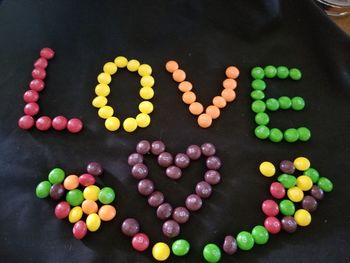 High angle view of multi colored candies on table