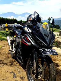 Motorcycle parked on field