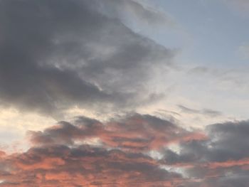 Low angle view of clouds in sky during sunset