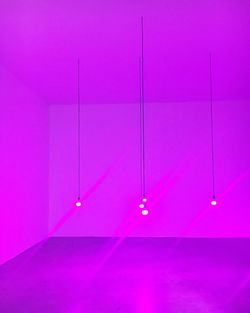 Illuminated lights in purple room