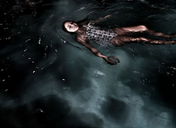 High angle view of girl swimming in sea