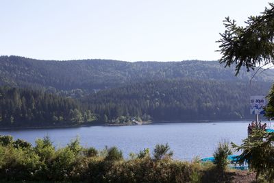 Scenic view of lake and mountains against sky