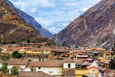 Houses against mountains at ollantaytambo