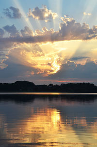 Scenic view of lake with reflection at sunset