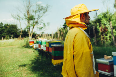 Man working on yellow cart