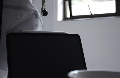 Close-up of laptop on table at home