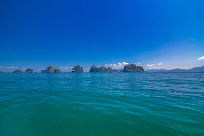 Scenic view of sea against clear blue sky