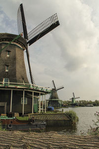 Traditional windmill against sky