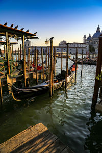 Boats moored in canal