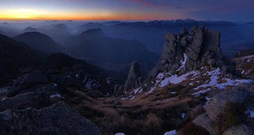 Scenic view of mountains against sky during sunset