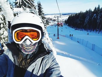 Portrait of man on snow covered mountain