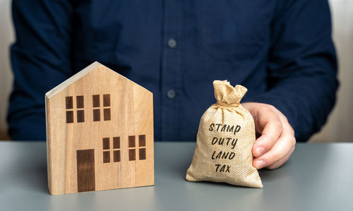 Midsection of man holding gift box