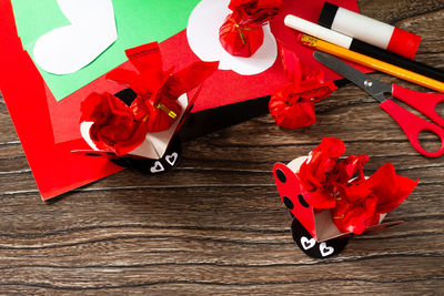 High angle view of red roses on table