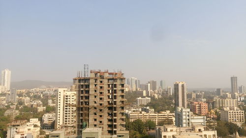 Scenic view of cityscape against sky