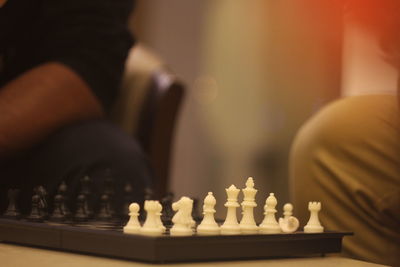 Close-up of chess playing on table