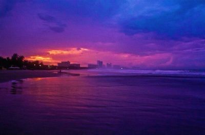 Scenic view of sea against cloudy sky