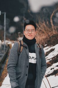 Portrait of young man standing outdoors