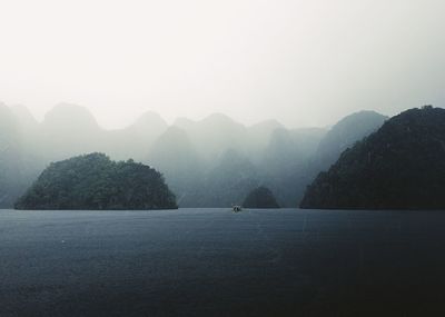 Scenic view of mountains against sky during foggy weather