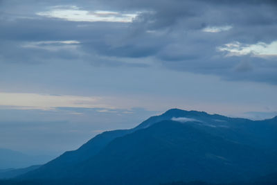 Scenic view of mountains against dramatic sky