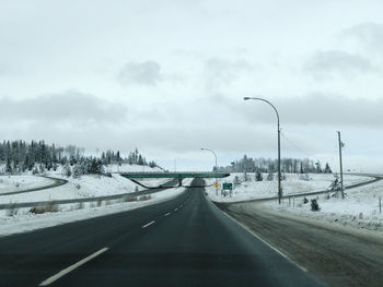 Snow-covered highway view near logan lake, british columbia, canada