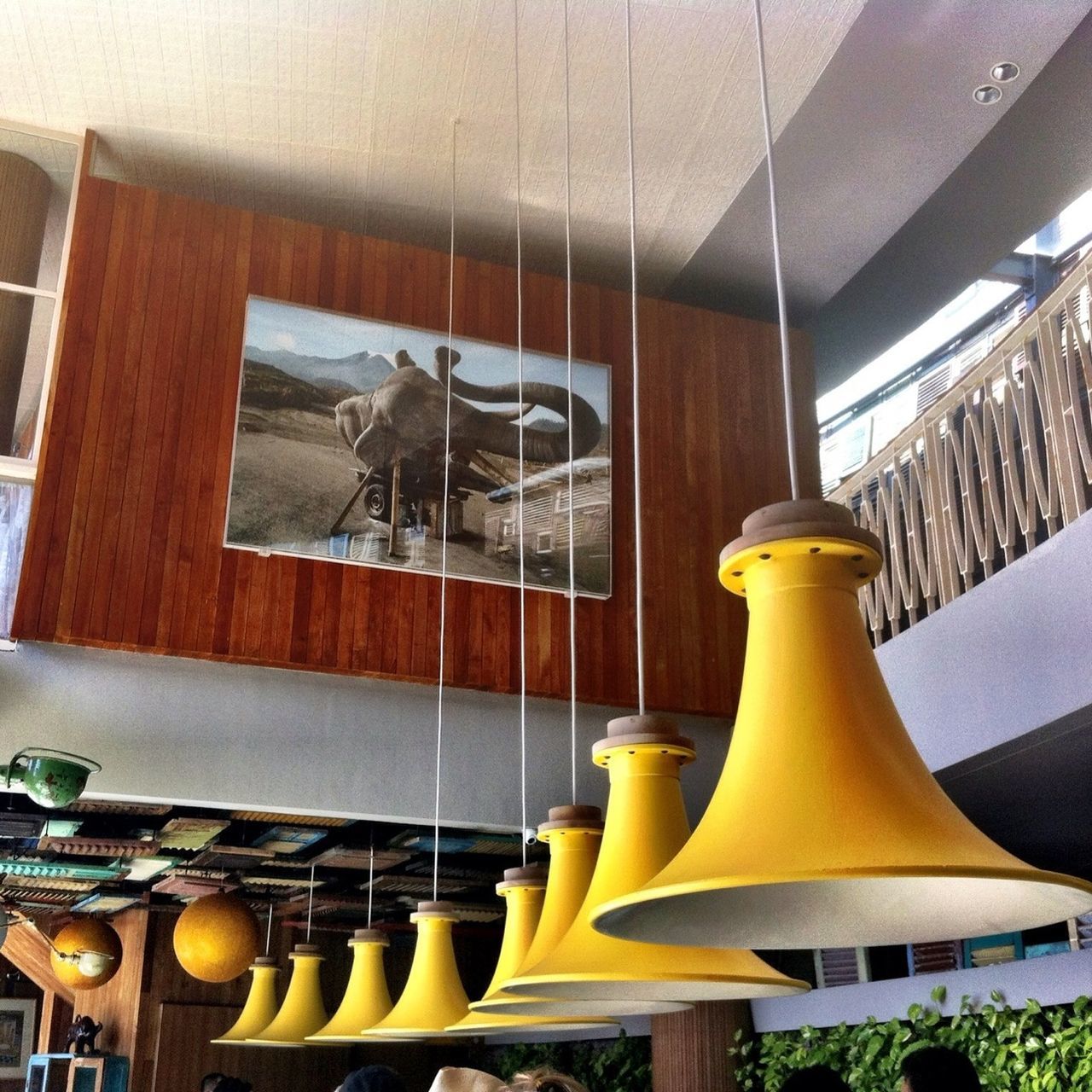 yellow, indoors, chair, in a row, architecture, hanging, no people, railing, built structure, absence, arrangement, table, side by side, day, variation, empty, group of objects, low angle view, seat, order