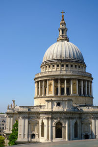 Low angle view of historic building against clear blue sky