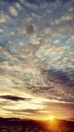 Scenic view of dramatic sky during sunset