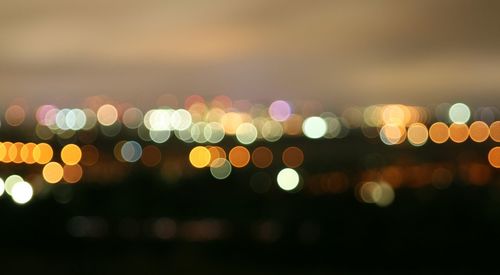 Defocused image of illuminated lights at night