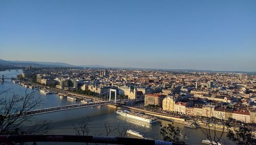 View of cityscape against blue sky