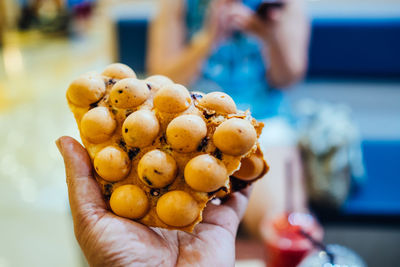 Close-up of hand holding berries