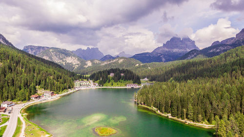 Scenic view of lake and mountains against sky