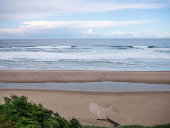 Scenic view of beach against sky