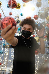 Portrait of boy holding decoration