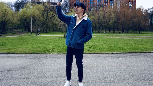 Full length of young man standing in park