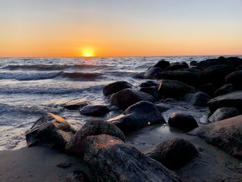 Scenic view of sea against sky during sunset