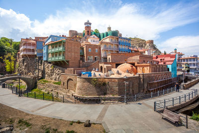 Buildings in city against sky